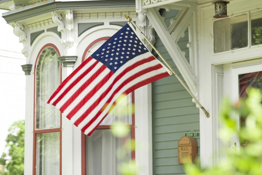 Close up of U.S. flag on exterior of a residence, representing the Target and Walmart flags tax.