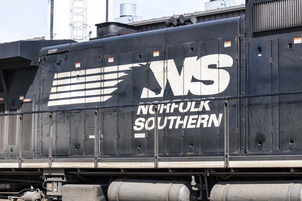 Close up of the Norfolk Southern logo on the side of a train engine, representing the Norfolk Southern train derailment.