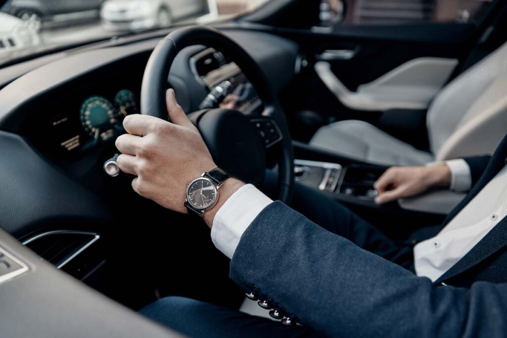 Close up of a businessman driving in his car, representing the worker commute study.