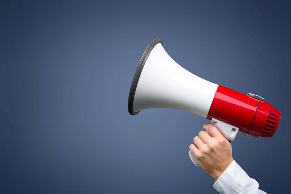 A womans hand holding a megaphone, representing top recalls for the week of Oct. 30.