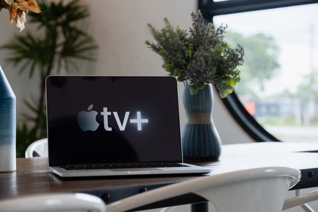 Apple tv logo displayed on a laptop, representing the Jon Stewart cancelation concerns.