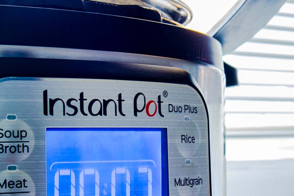 Close up of Instant Pot logo on a pressure cooker, representing the Instant Pot lawsuit.