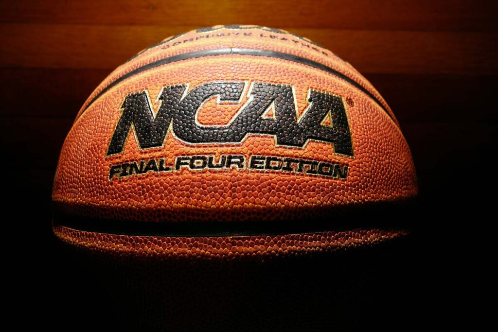 Close up of the NCAA logo on a basketball, representing the NCAA student athletes class action.