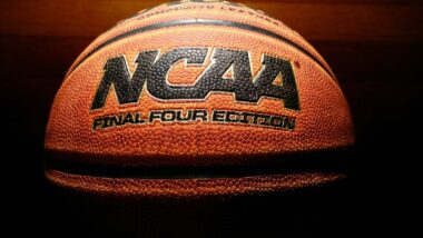 Close up of the NCAA logo on a basketball, representing the NCAA student athletes class action.