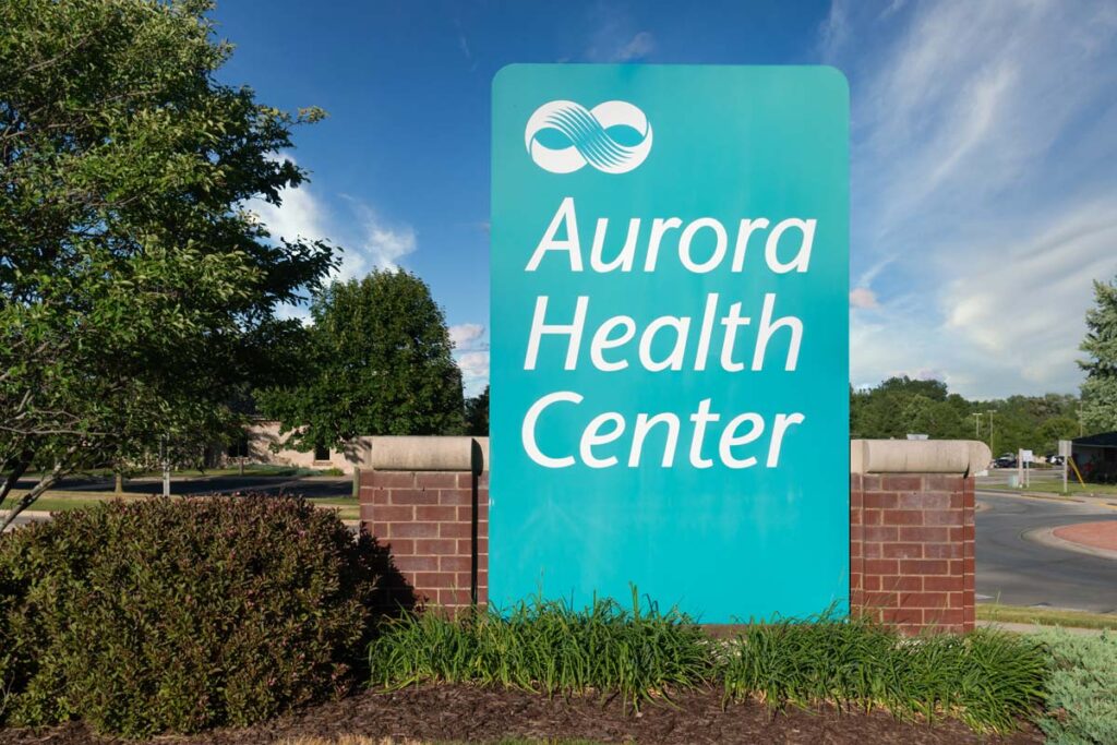 Aurora Health Center signage, representing the Advocate Aurora Health pixel tracking class action lawsuit settlement.