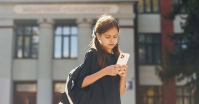 Close up of a young girl using a smartphone, representing the social media multidistrict legislation.