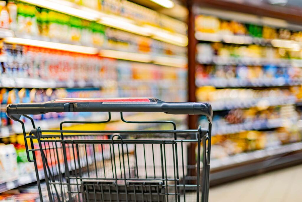 Close up of a shopping cart in a grocery store, representing top recalls for the week of Nov. 13.