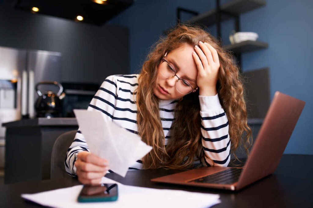 Women unhappy after calculating her paycheck representing recent employee class action lawsuits.