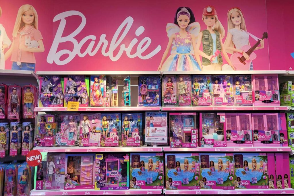 Barbie products on a shelf, representing Mattel Barbie sales.