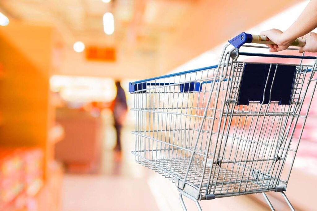 Close up of a woman pushing a shopping cart, representing top recalls for the week of Nov. 6.