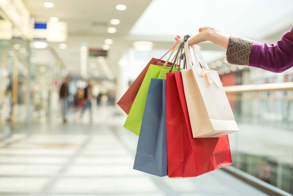 Close up of a woman holding shopping bags, representing top recalls for the week of Nov. 20.