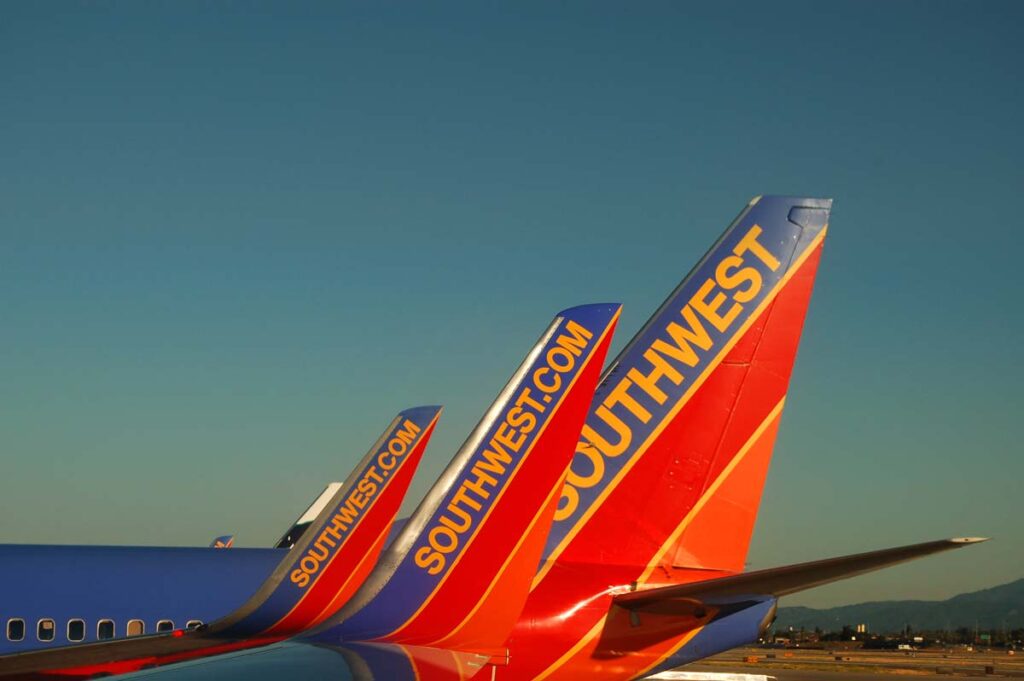 Tails of Southwest Airlines planes, representing Southwest flight cancellations.