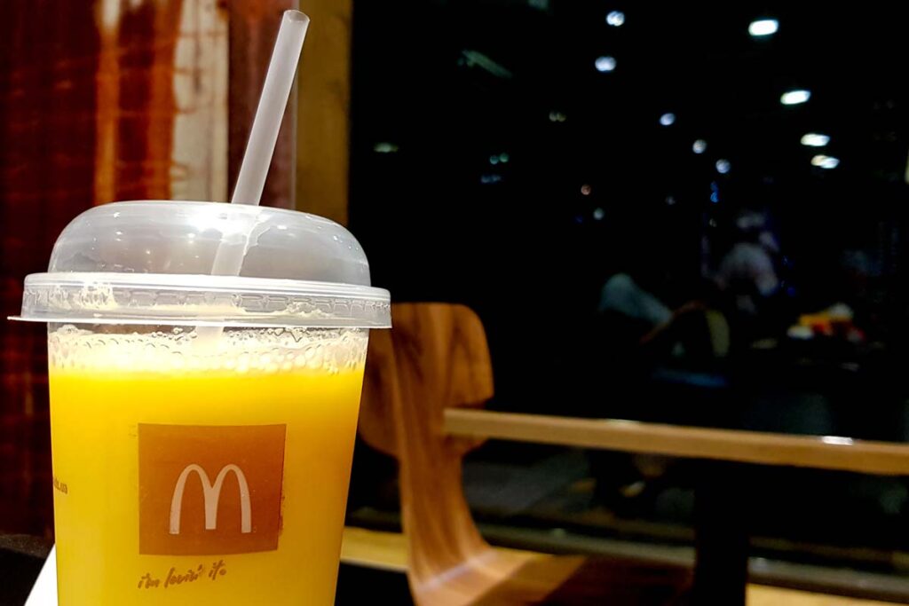 Close up of McDonalds orange juice, representing the McDonald's class action over breakfast combos.