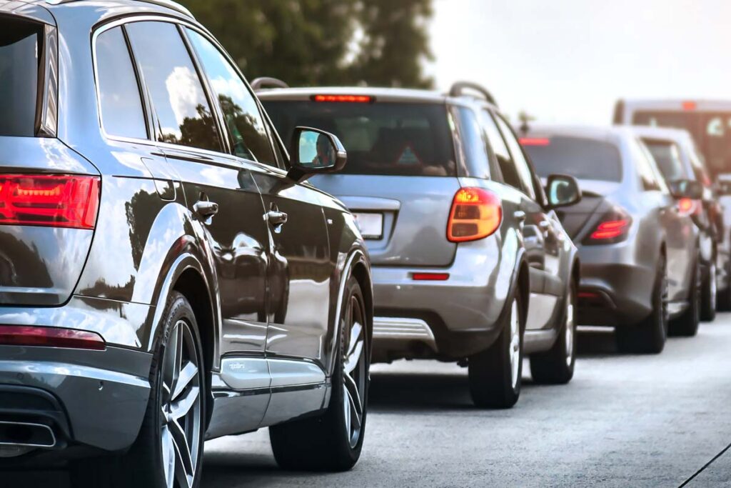 A line of cars on a road, representing auto companies with a recall in December.