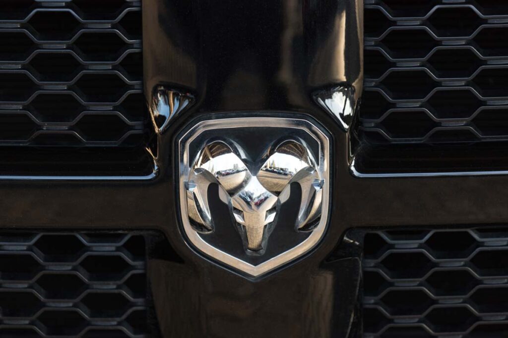Close up of a Ram emblem on a front bumper, representing the Chrysler Ram and Cab Chassis recall.