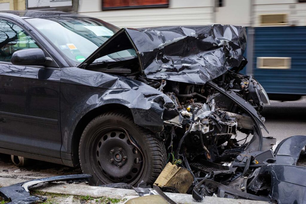 Close up of a total loss vehicle, representing the Owners Insurance class action lawsuit settlement.