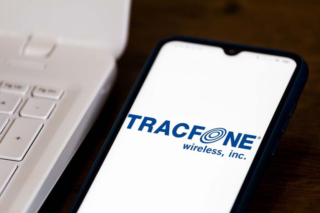 Close up of the Tracfone logo displayed on a smartphone, representing the TracFone settlement.