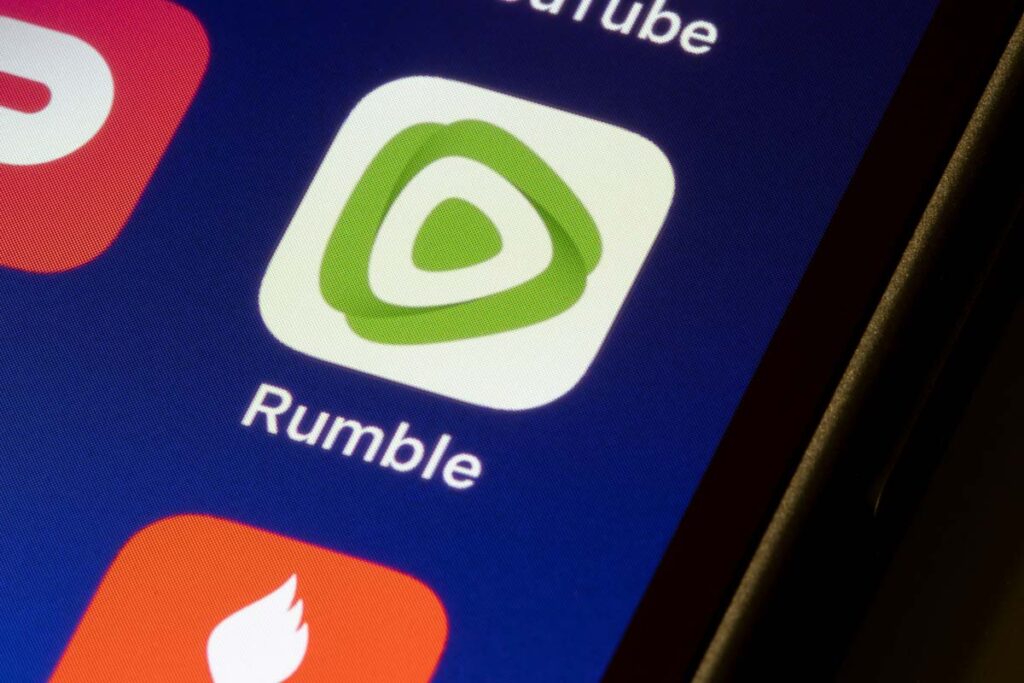 Close up of the Rumble app icon displayed on a smartphone screen, representing the Rumble class action.