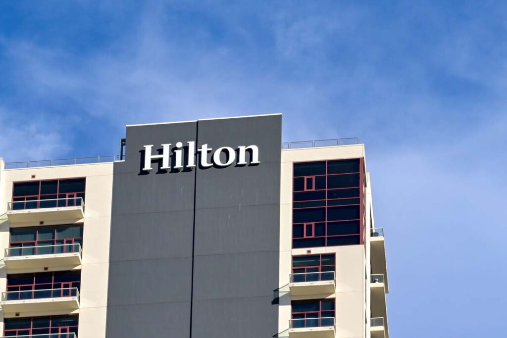 Close up of Hilton Hotel signage, representing the Hilton hidden fees lawsuit.