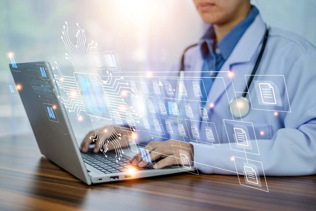 Close up of a doctor typing on a laptop with a patient data concept overlay, representing the PracticeMax data breach class action lawsuit settlement.