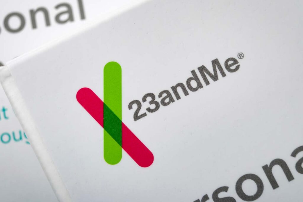 Close up of 23 and Me logo on a DNA collection box, representing the 23andMe data breach class action lawsuit.