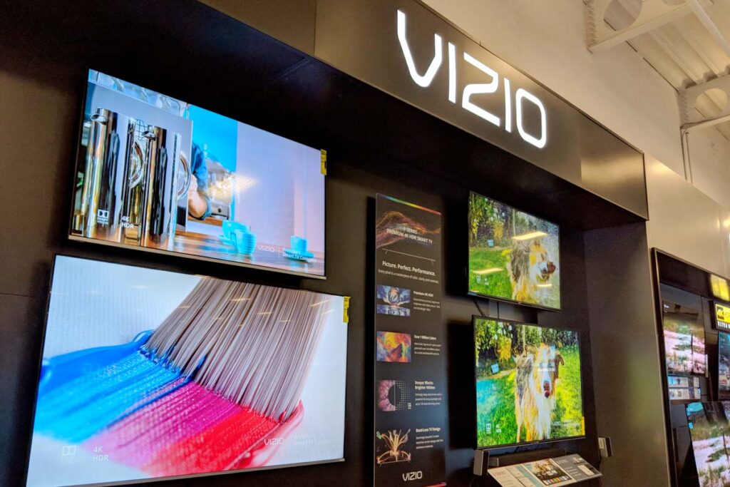 Vizio televisions for sale inside of a store, representing the Vizio refresh rate class action settlement.