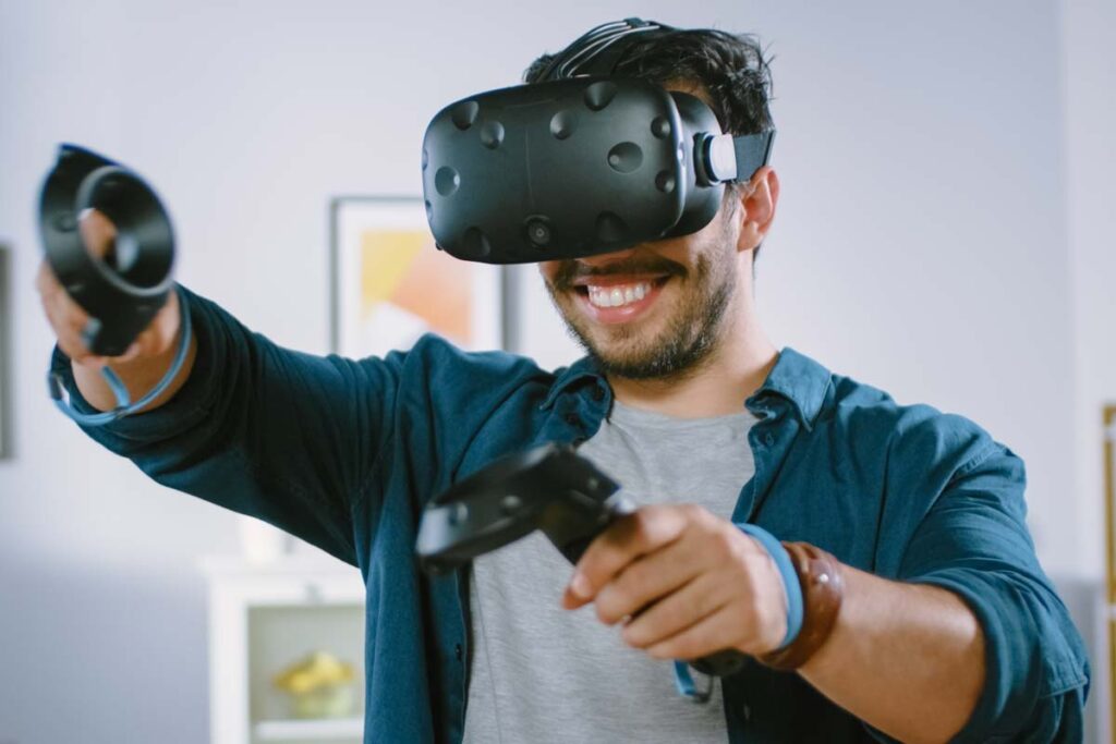 A man using a VR headset, representing VR headset and augmented reality glasses sales.