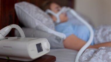 Woman sleeping with cpap machine