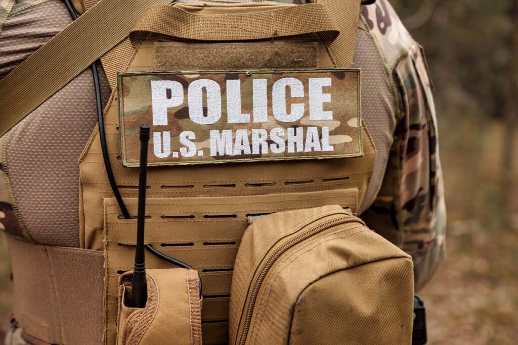 Close up of a U.S. Marshal uniform, representing the U.S. Marshals EEOC settlement.