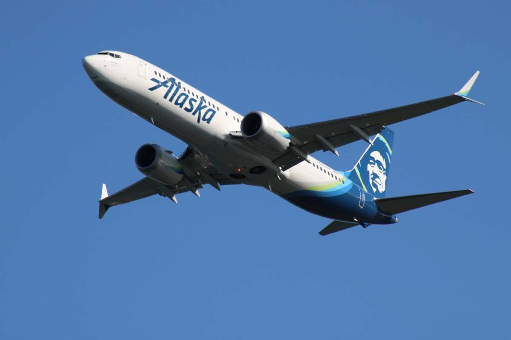Alaska Airlines plane in flight, representing the Boeing class action.