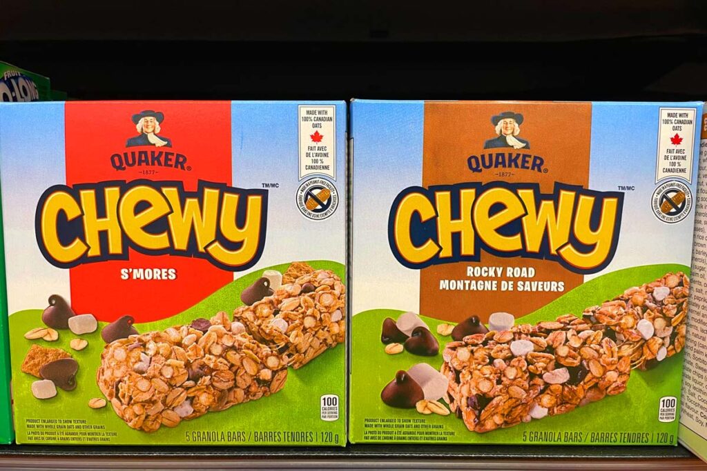 Quaker granola bar boxes on a supermarket shelf, representing the Quaker class action.
