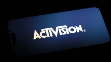 Activision logo displayed on a smartphone, representing the Activision employee discrimination lawsuit.