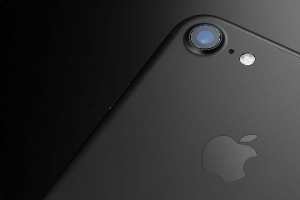 Closeup of the back of a black iPhone 7, representing the Apple audio class action lawsuit settlement.