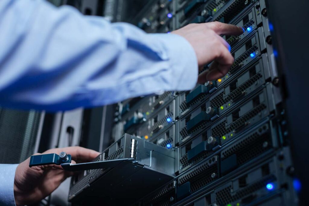 Close up of an IT engineers hands working on a network server, representing the Dollar Bank class action.