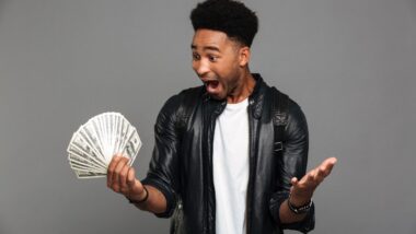 Man excited with cash in hand.