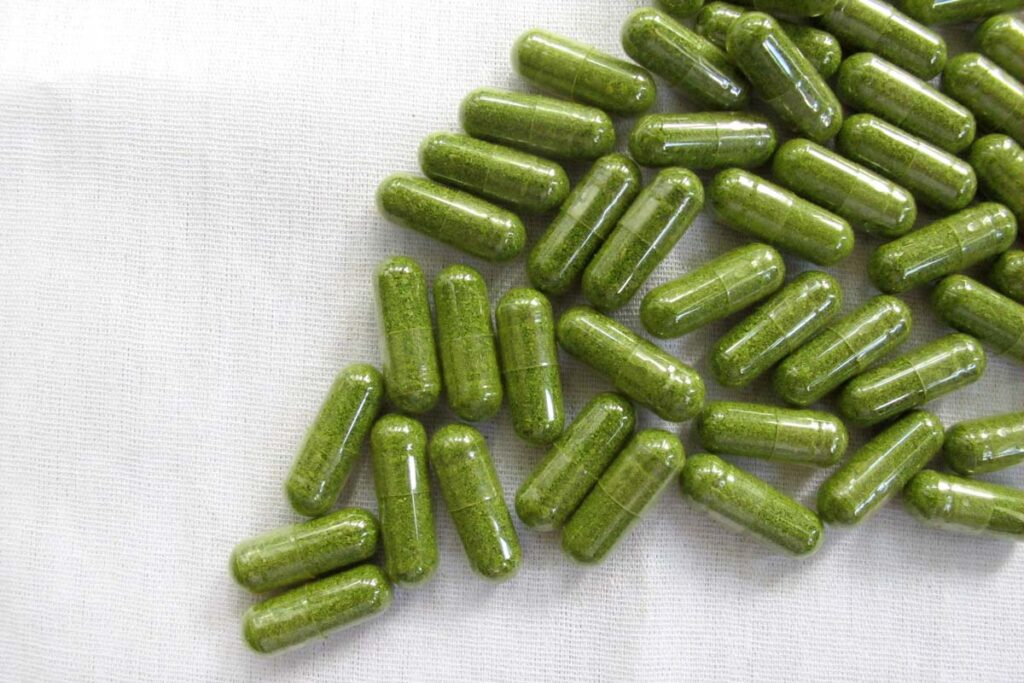 Close up of green capsules, representing the Balance of Nature class action lawsuit.