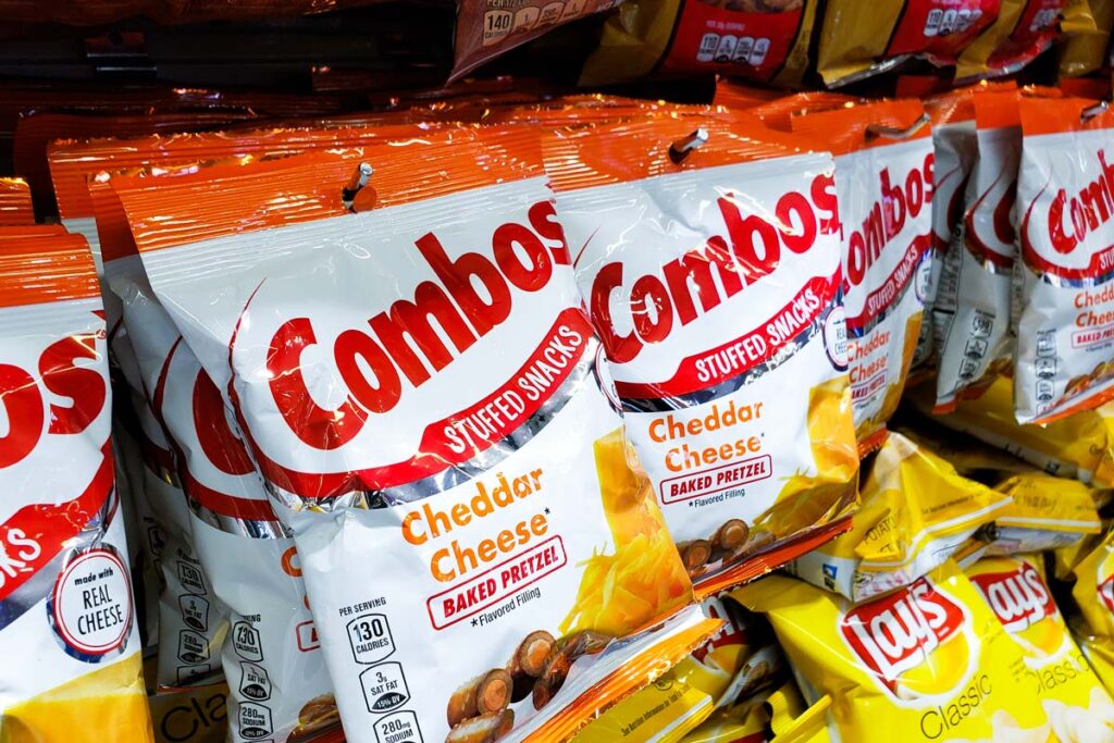 Close up of Combos Cheddar snacks for sale in a supermarket, representing the Combos class action.