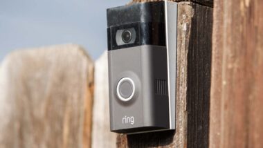 An Amazon Ring doorbell attached to a fence, representing Amazon Ring video.