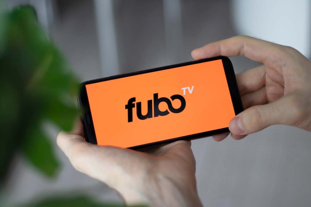 Close up of Fubo TV logo displayed on a smartphone, representing the Fubo lawsuit.