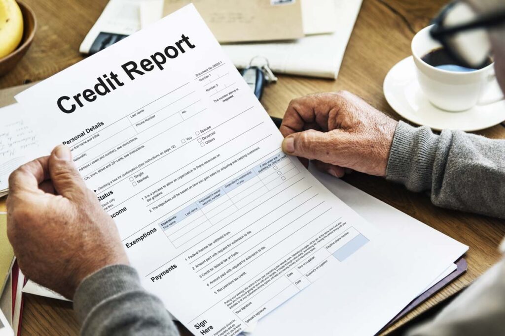 Closeup of an elderly man reading his credit report, representing the Universal Credit Services Fair Credit Reporting Act class action settlement.