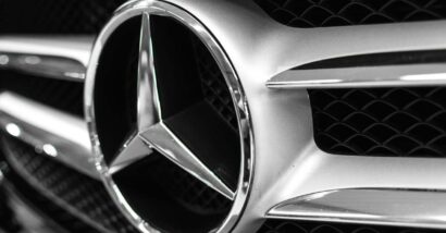 Close up of an Mercedes emblem on a front bumper, representing the Mercedes-Benz defects.