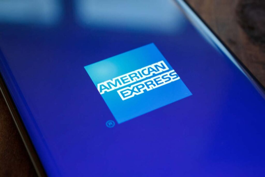 Close up of an American Express logo displayed on a smartphone, representing the American Express class action.
