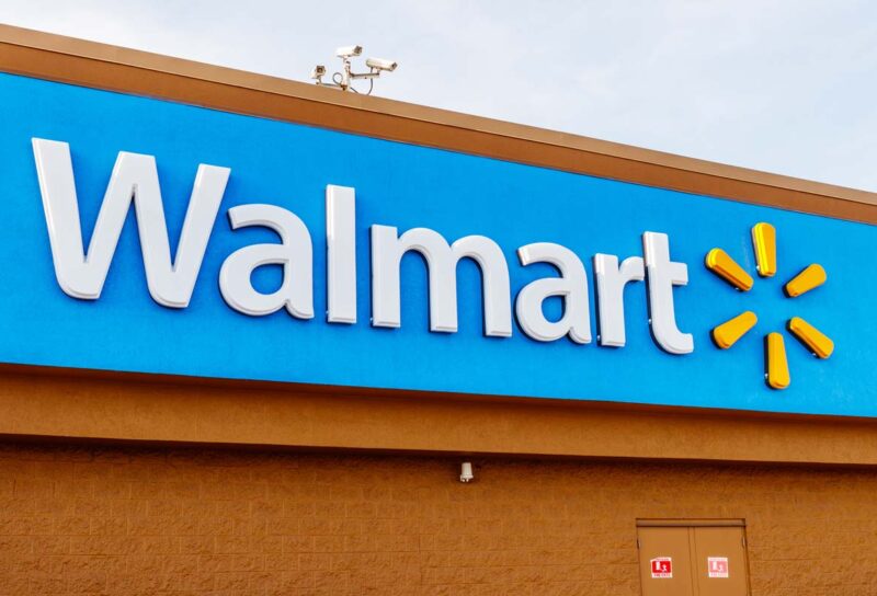 Close up of Walmart signage, representing Walmart lawsuits and settlements.