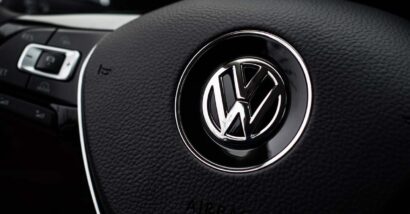 Close up of VW emblem on a steering wheel, representing the VW recall.
