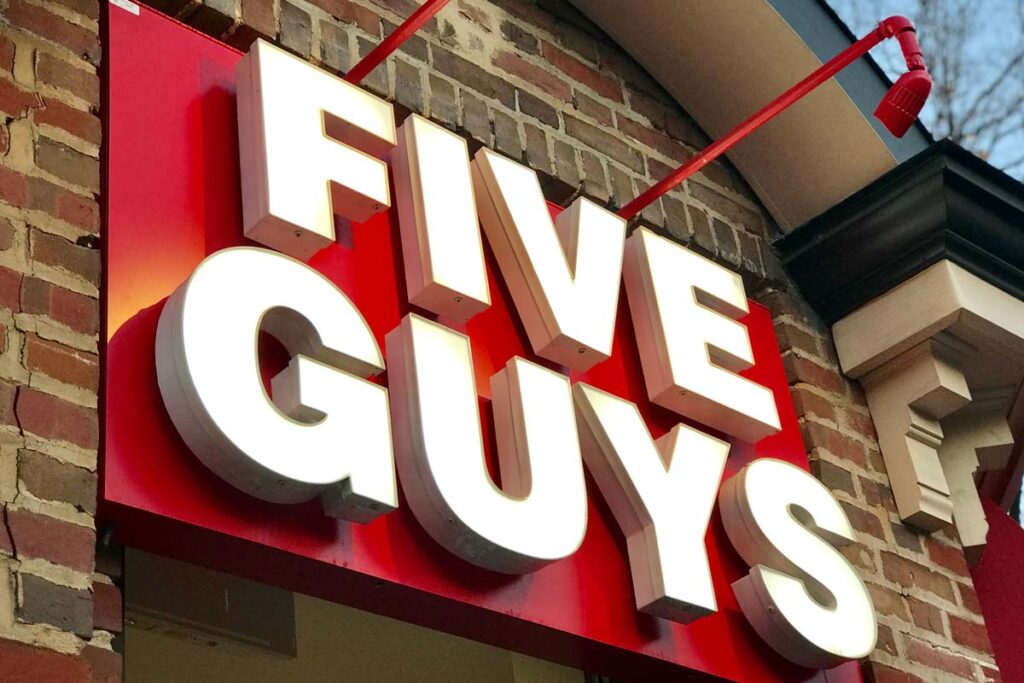 Close up of Five Guys signage, representing the Five Guys data breach class action lawsuit settlement.