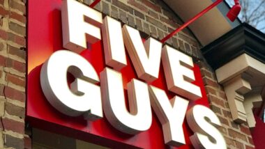 Close up of Five Guys signage, representing the Five Guys data breach settlement.