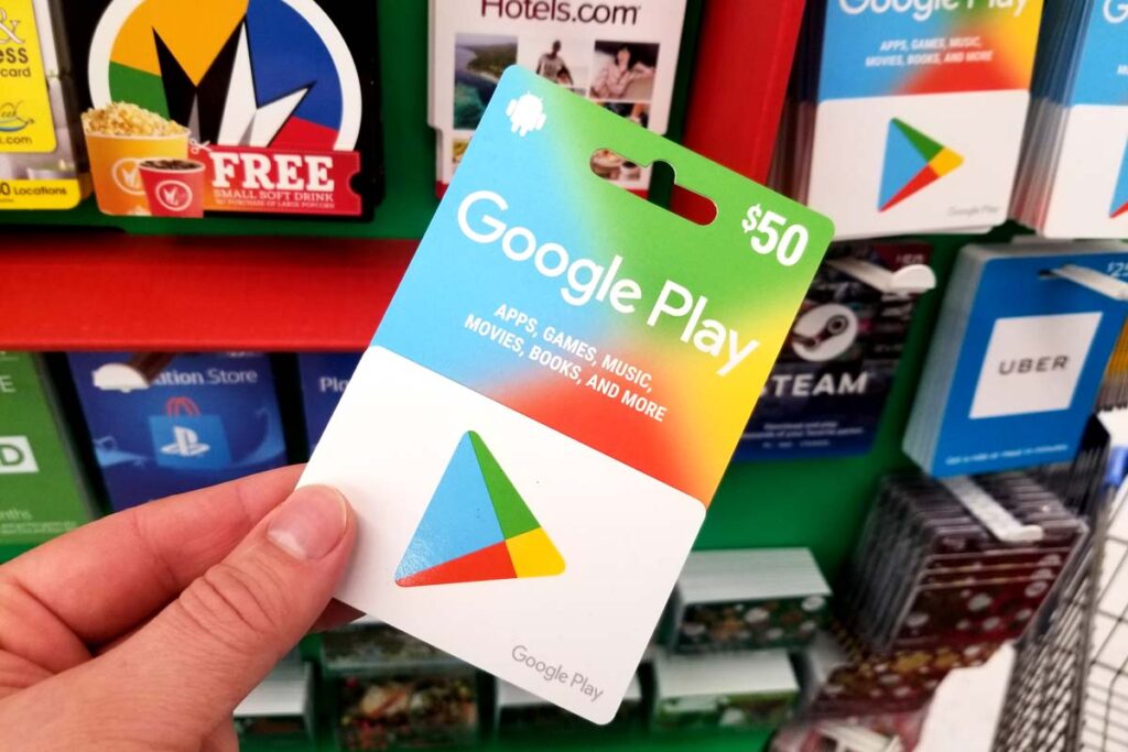 Close of a hand holding a Google Play Store gift card, representing the Google gift card class action.