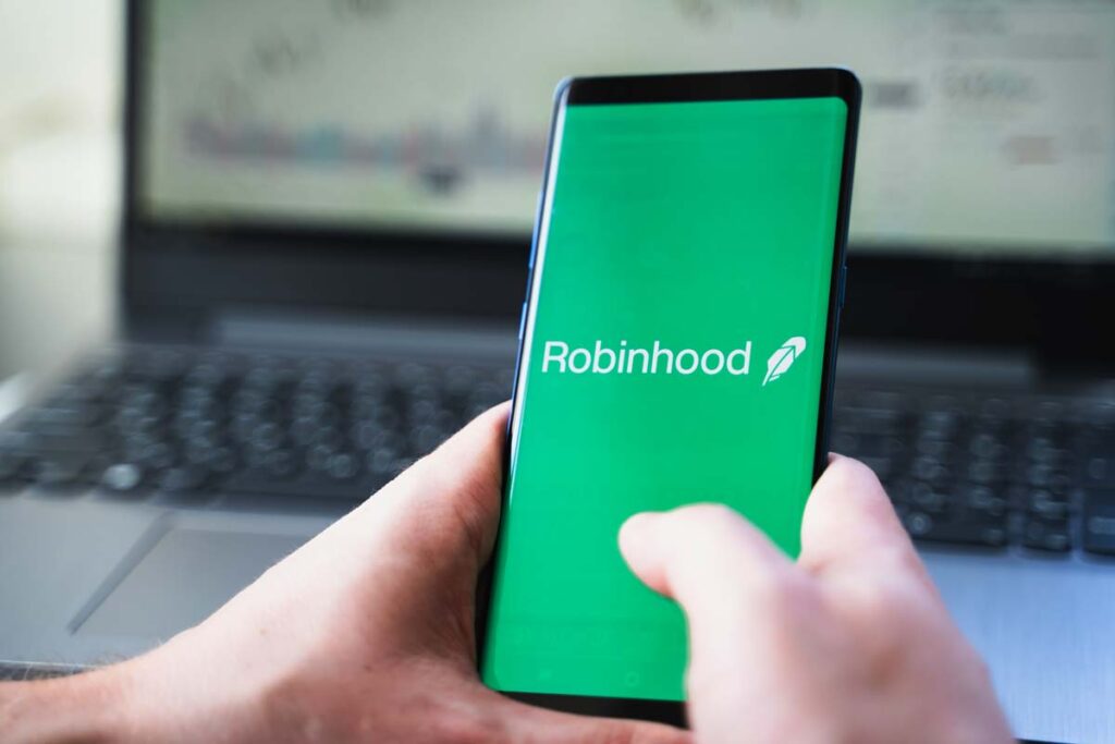 Close up of Robinhood logo displayed on a smartphone screen, representing the Robinhood referral text messages class action lawsuit settlement.