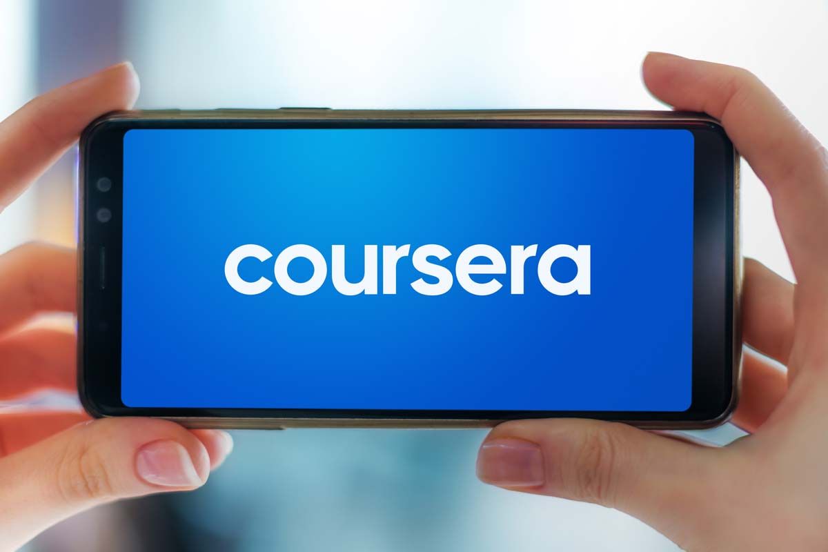 Coursera logo displayed on a smartphone screen, representing the Coursera class action.