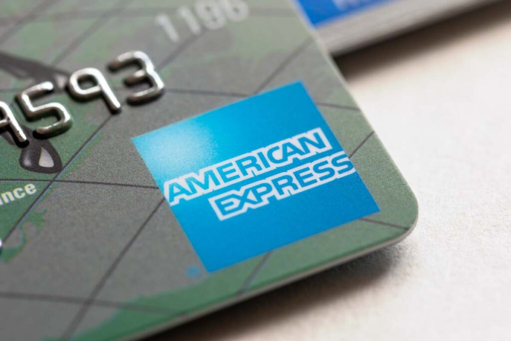 Close up of American Express logo seen on a credit card, representing the AmEx swipe fees class action.
